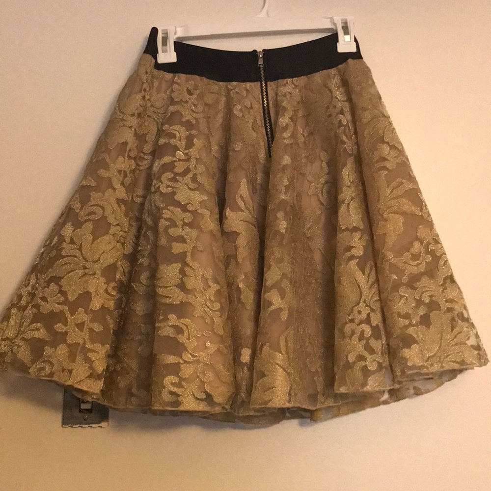 Gold Bebe skirt, never worn, size Medium.